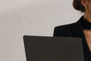 a bueautiful young woman with a laptop